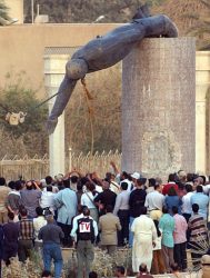 toppling the statue of Saddam Hussein
